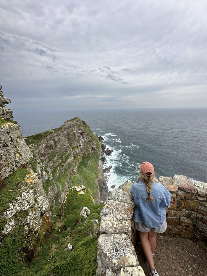 Yulia looking out over the cliffs at Cape Point, South Africa